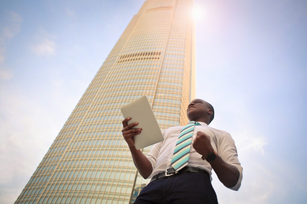 man standing near high-rise building gratitude goals